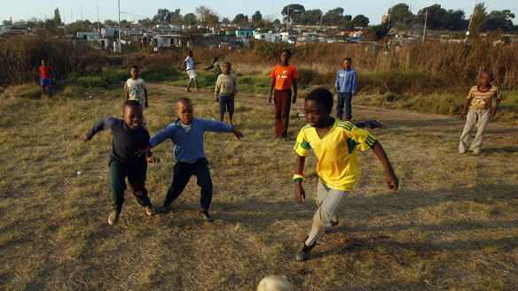 Children Playing Football In Africa