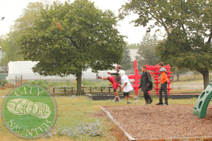 Children Playing Football In Rain