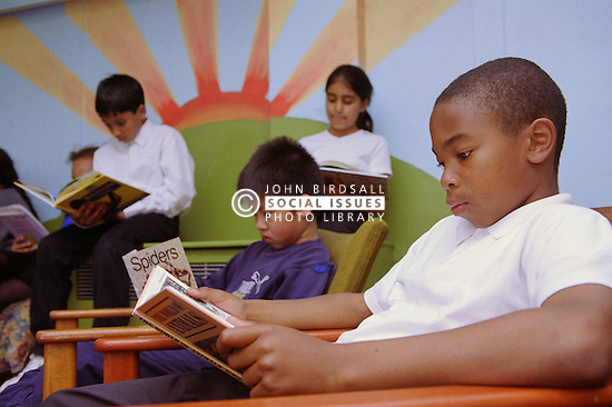 Children Reading Books In Library